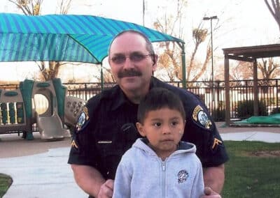 Police man with a small boy.
