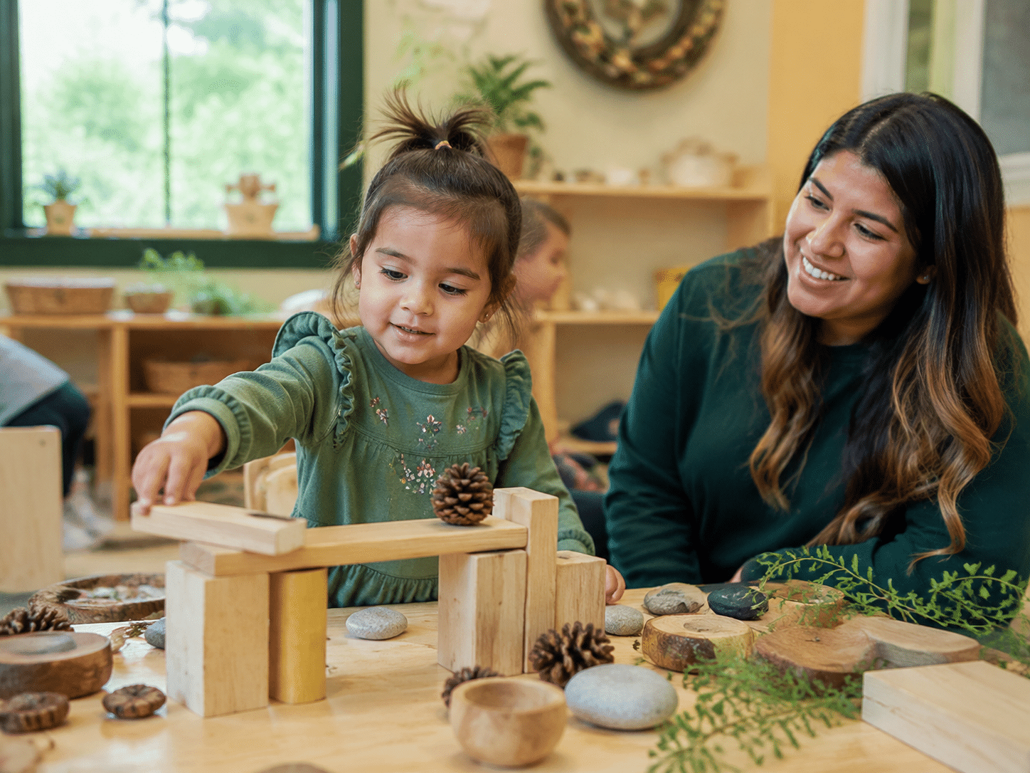 Educator with child, dedicated to supporting young children and their families